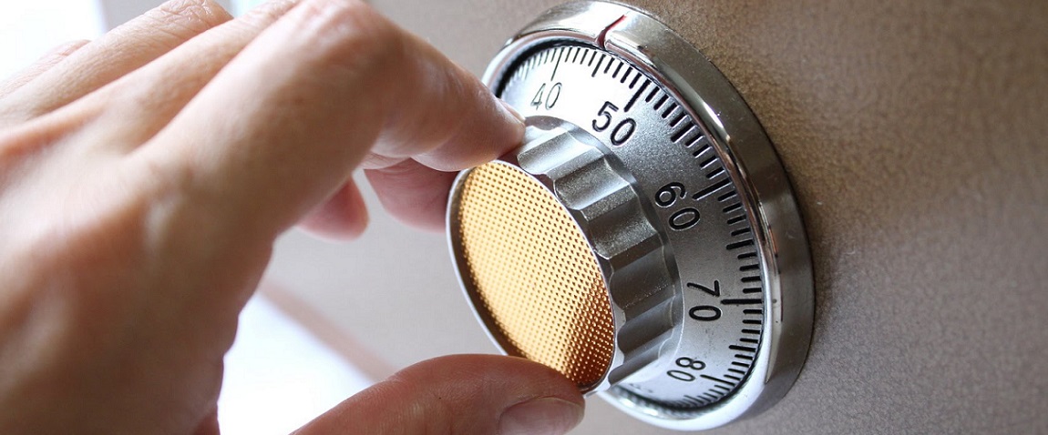 Professional locksmith opening a safe