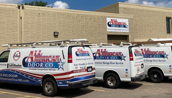 All American Door vans on site