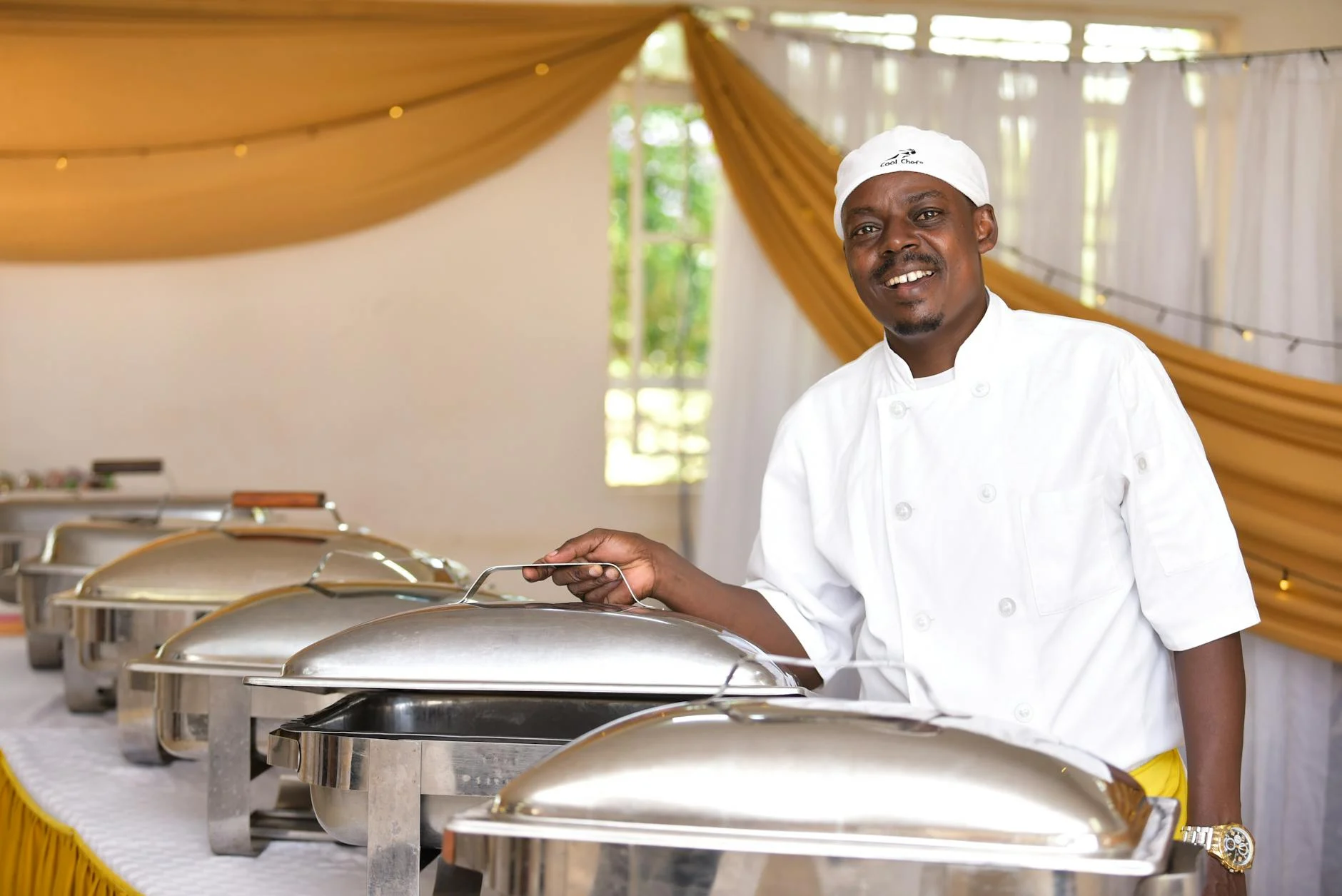 Professional catering chef with buffet
