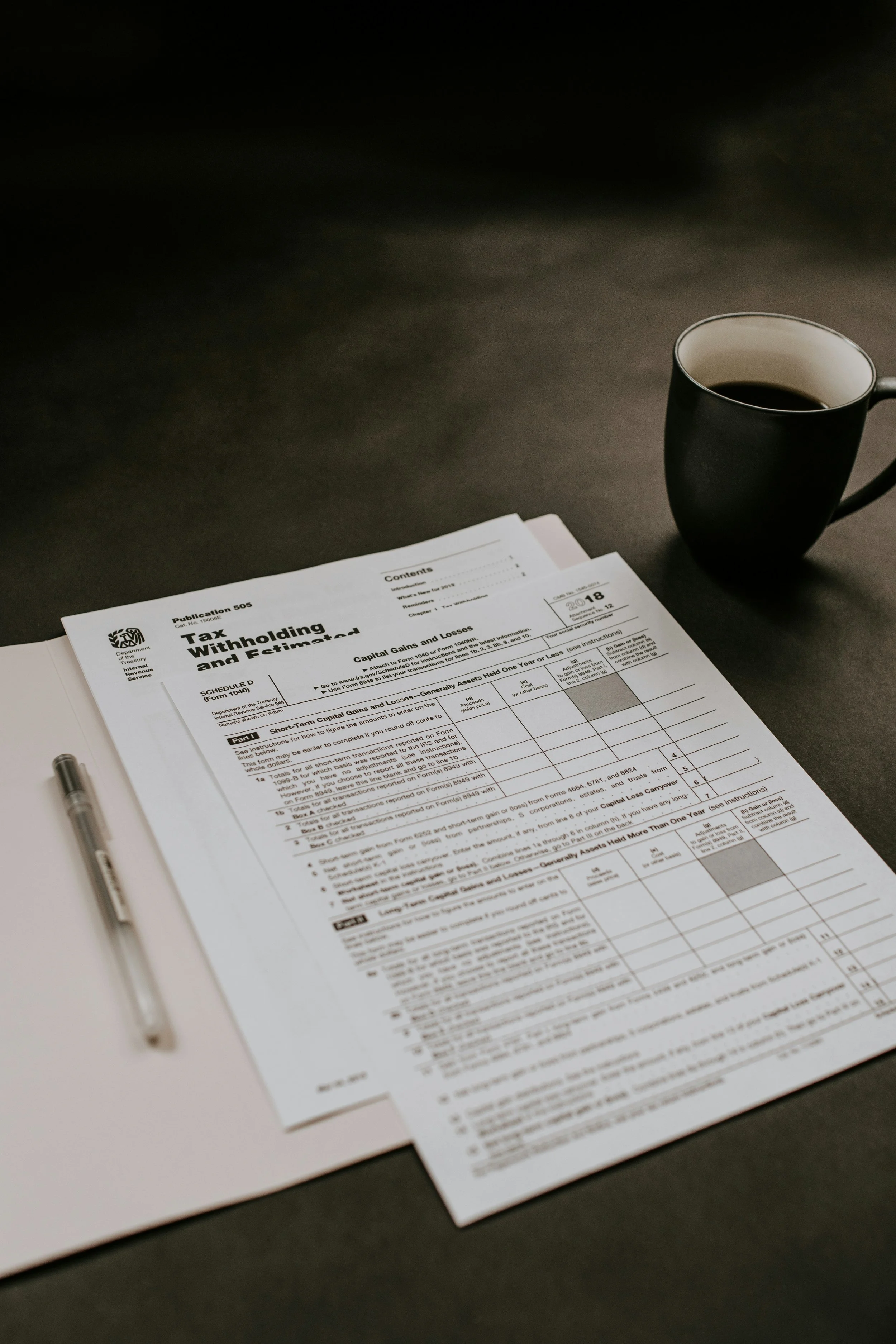 Tax form with pen and coffee