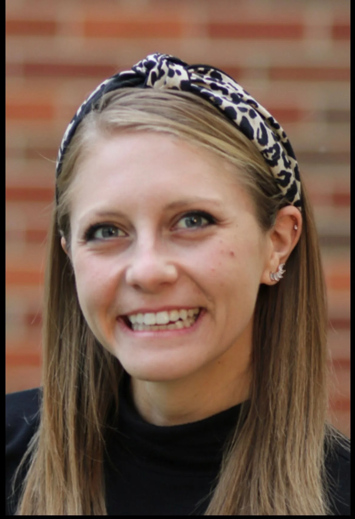 Young person smiling confidently, representing social group success