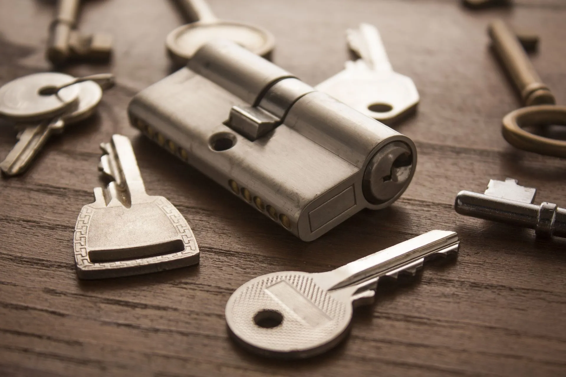 Keys and locks on a wooden table