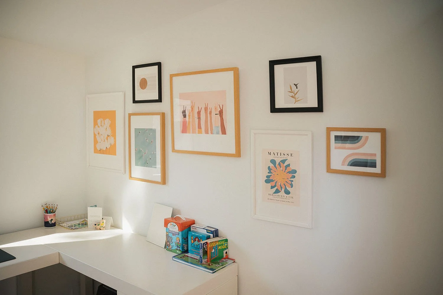 Gallery wall of art in the office