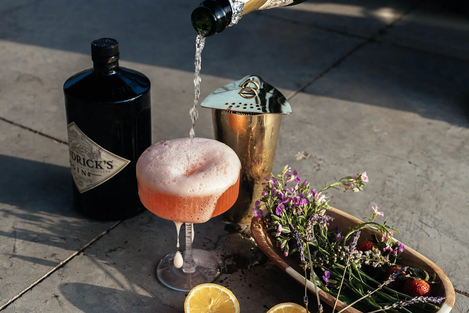 Craft cocktail with Hendricks gin and fresh garnishes