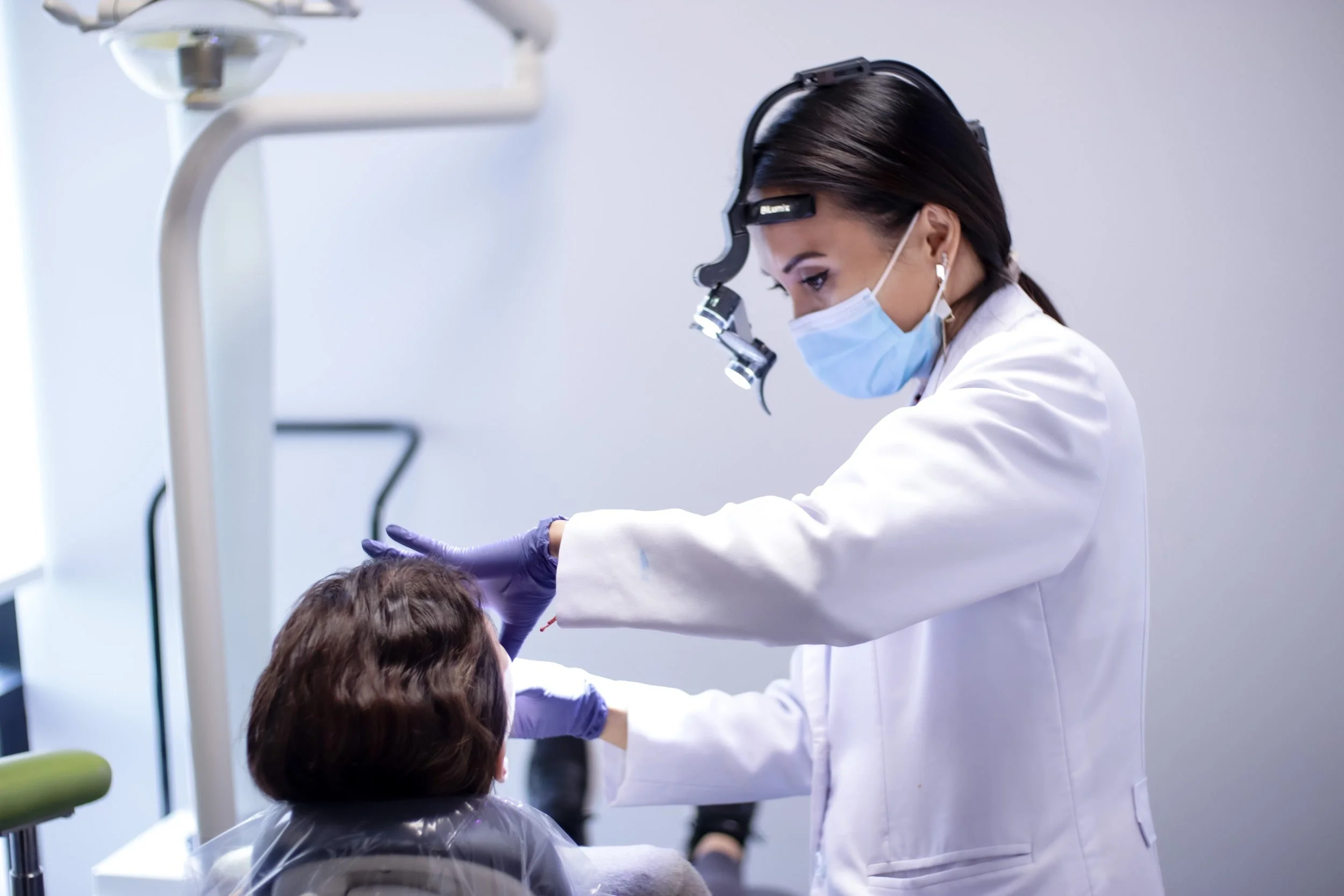San Diego TMJ Dentist examining a patient