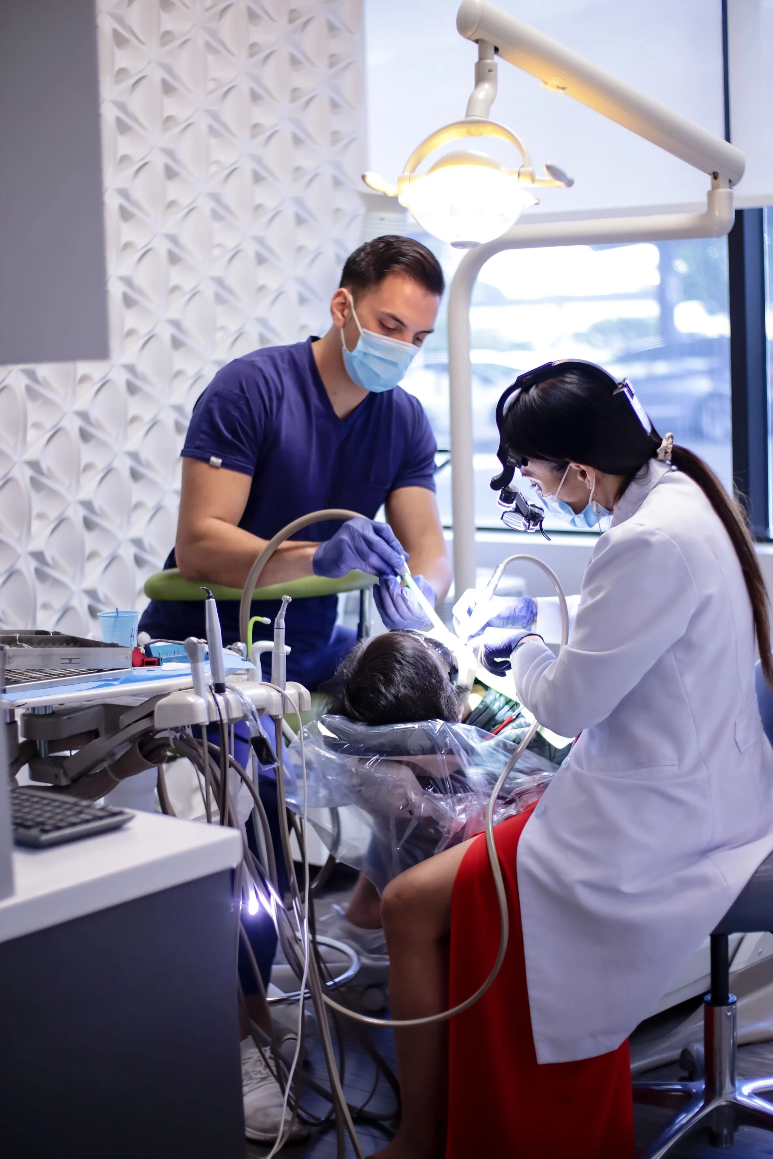San Diego Dentist placing a dental crown on a patient