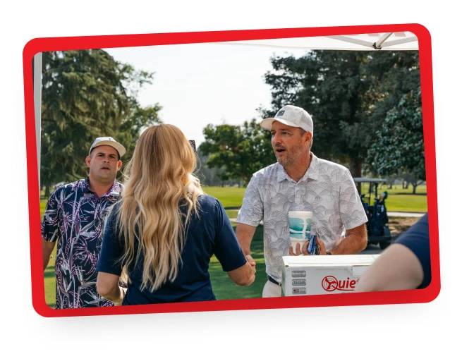 Team members at golf course event