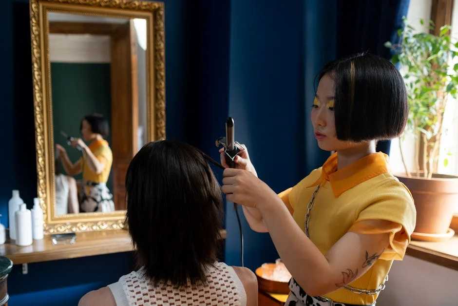 Hairdresser styling client's hair