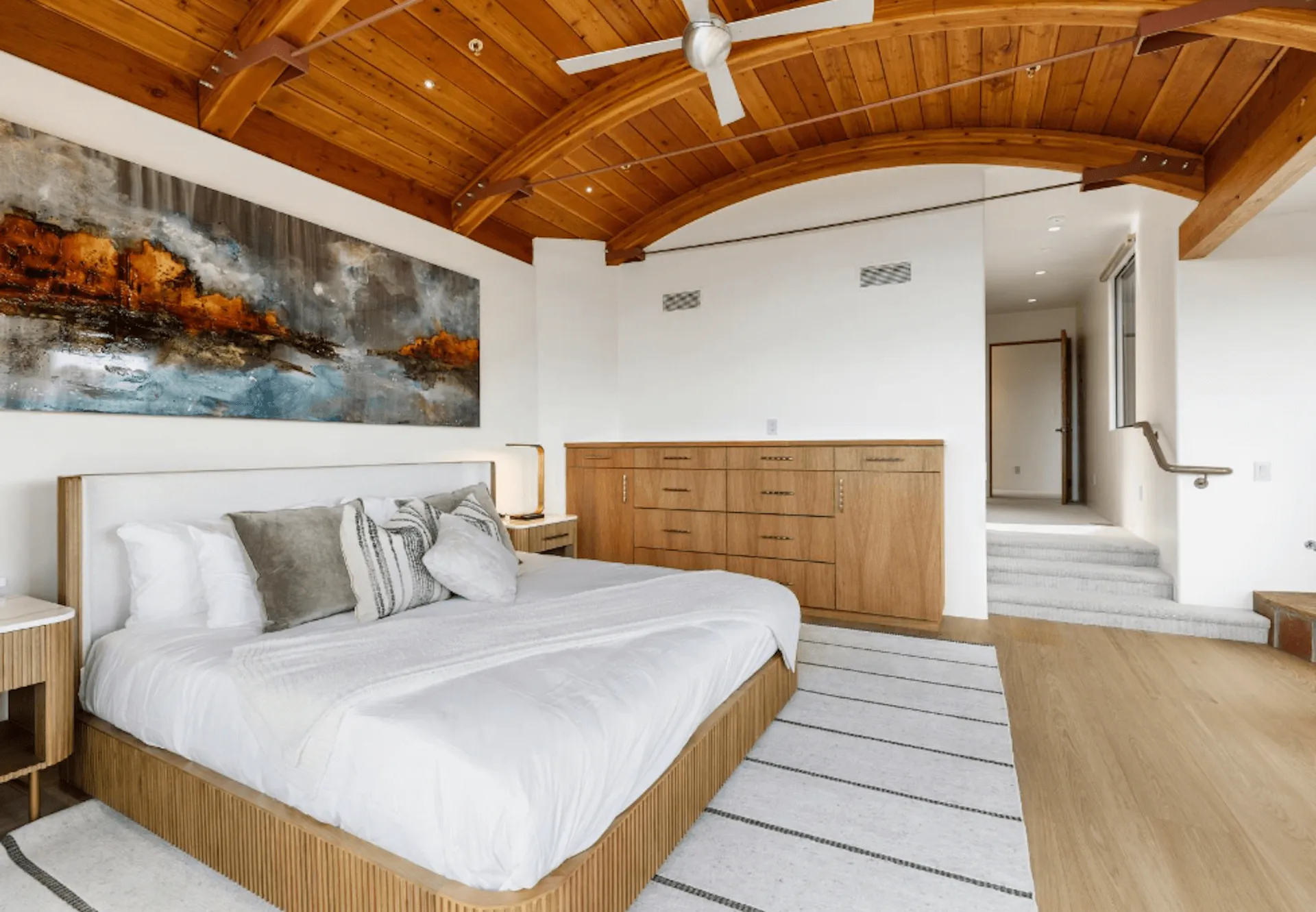 A luxury bedroom with wooden ceiling