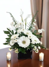 Sympathy and funeral flowers - white soft-toned arrangements