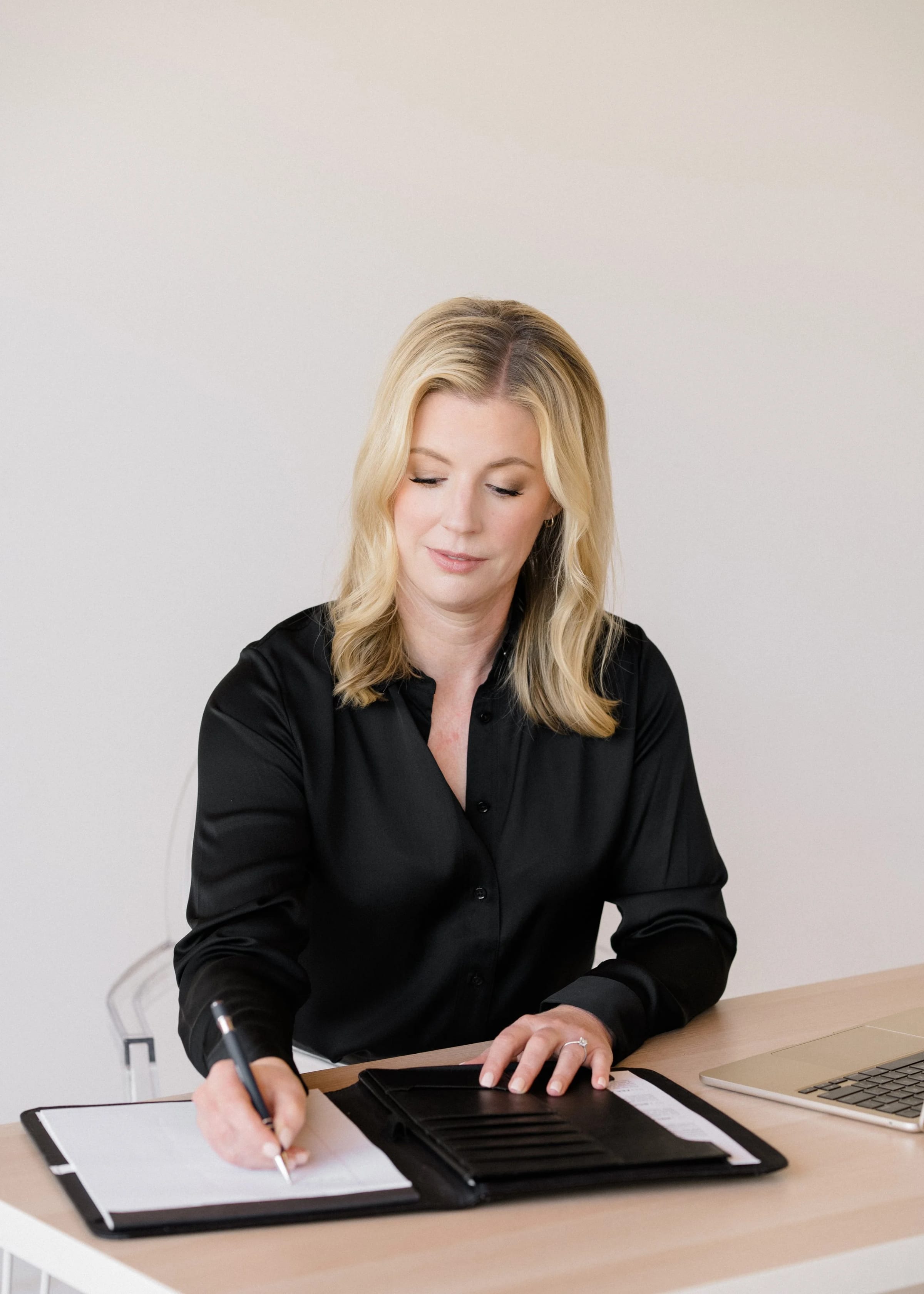 Jessica Webb writing notes in her notebook