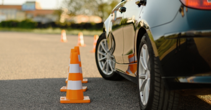 Teen driving lesson with cones