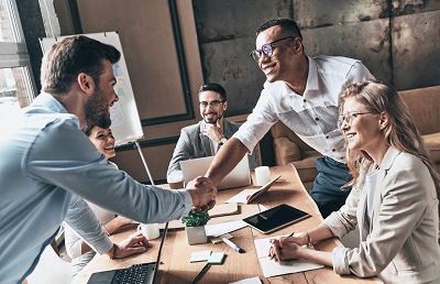 business people shaking hands in meeting