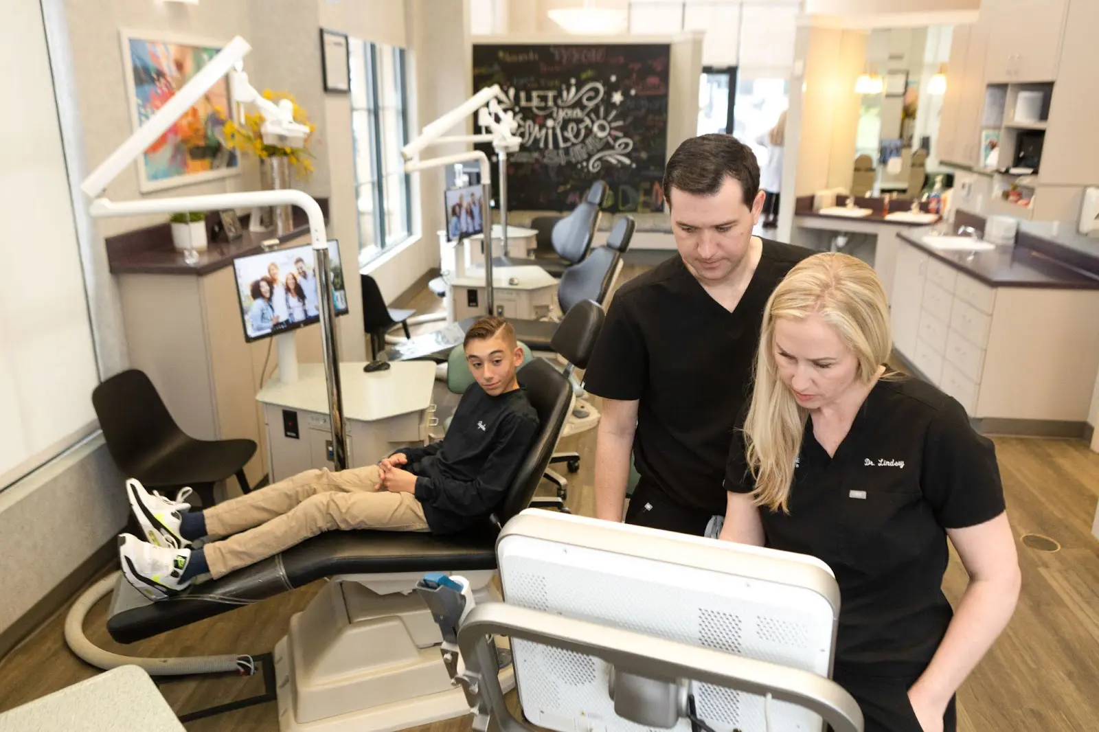 Koerich Orthodontics team reviewing patient progress