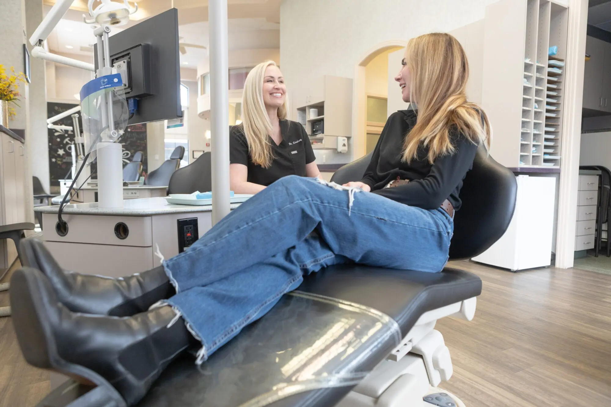 At Koerich Orthodontics, a dental professional reviews a treatment plan with a patient