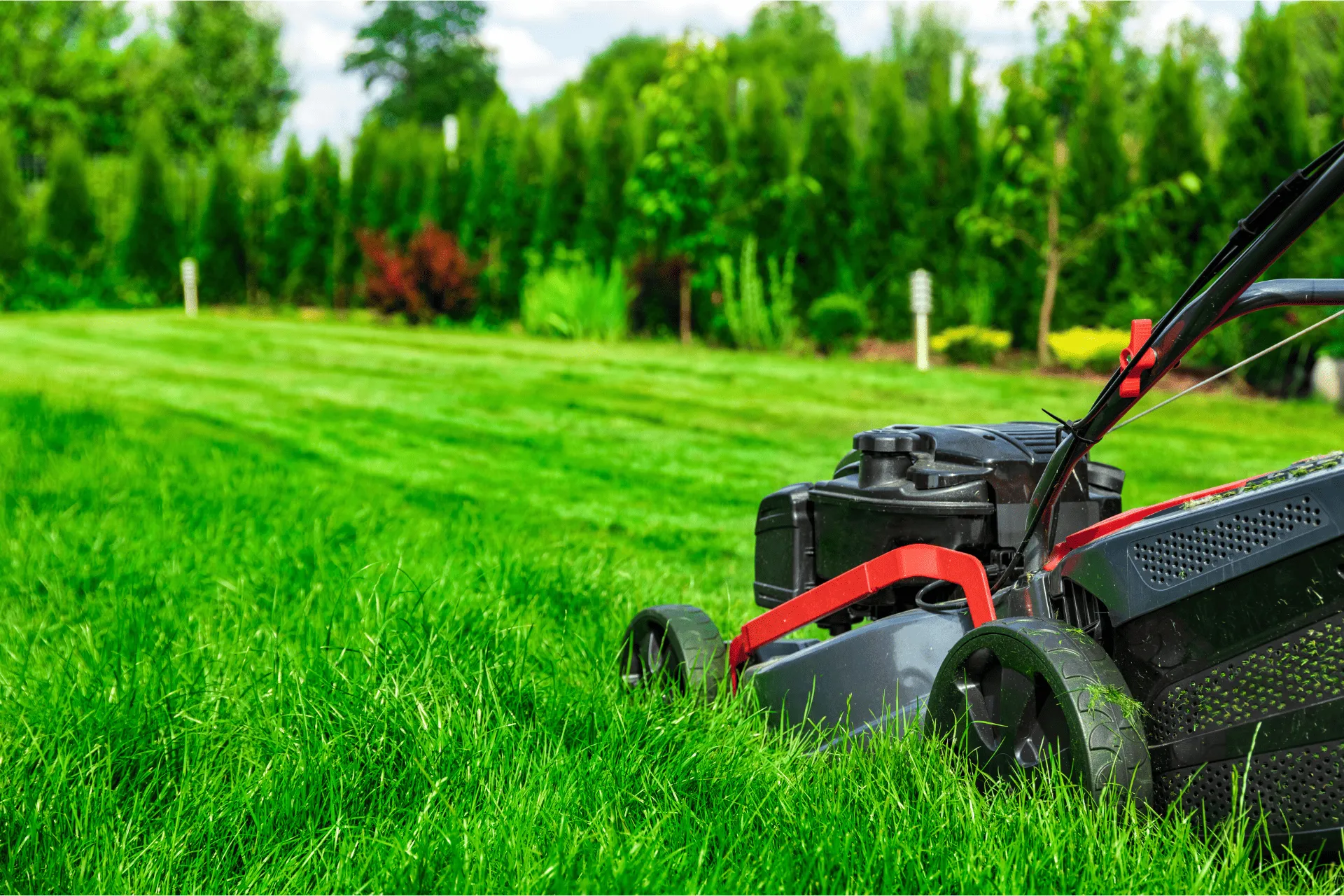 Landscaper mowing lawn