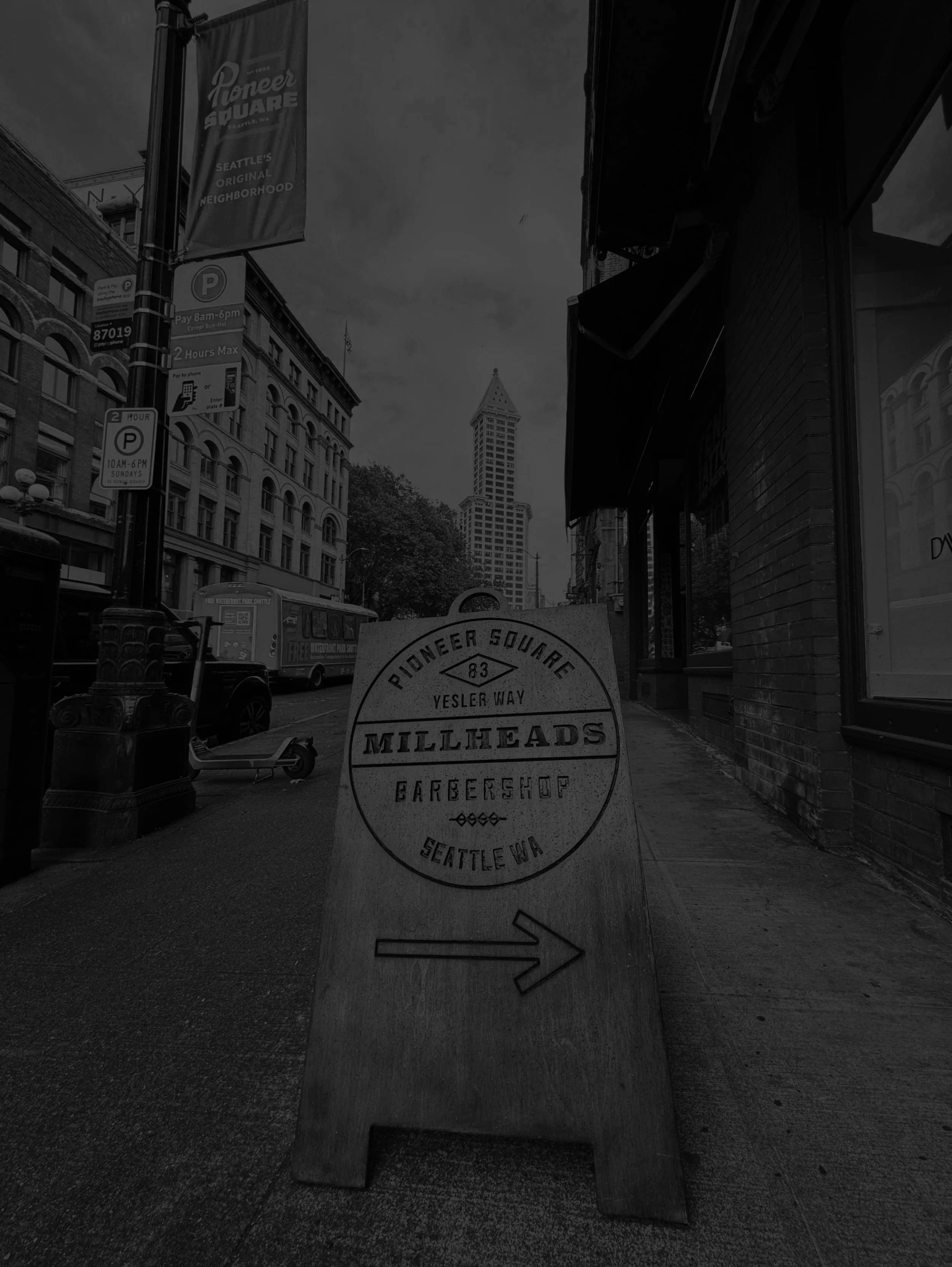 Custom wooden sign for Millheads Barbershop on Yesler Way Seattle