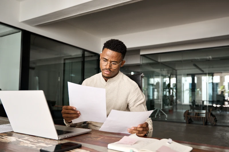 Mortgage underwriter reviewing documents