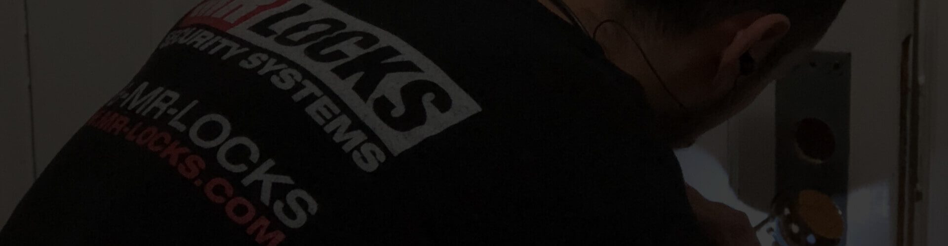 Locksmith installing a lock