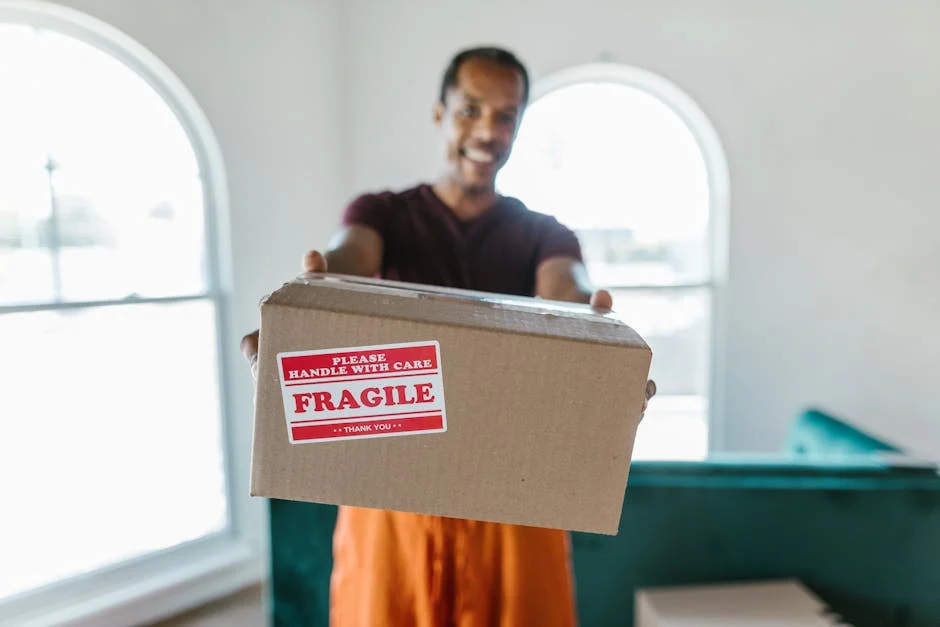 Person holding fragile box carefully