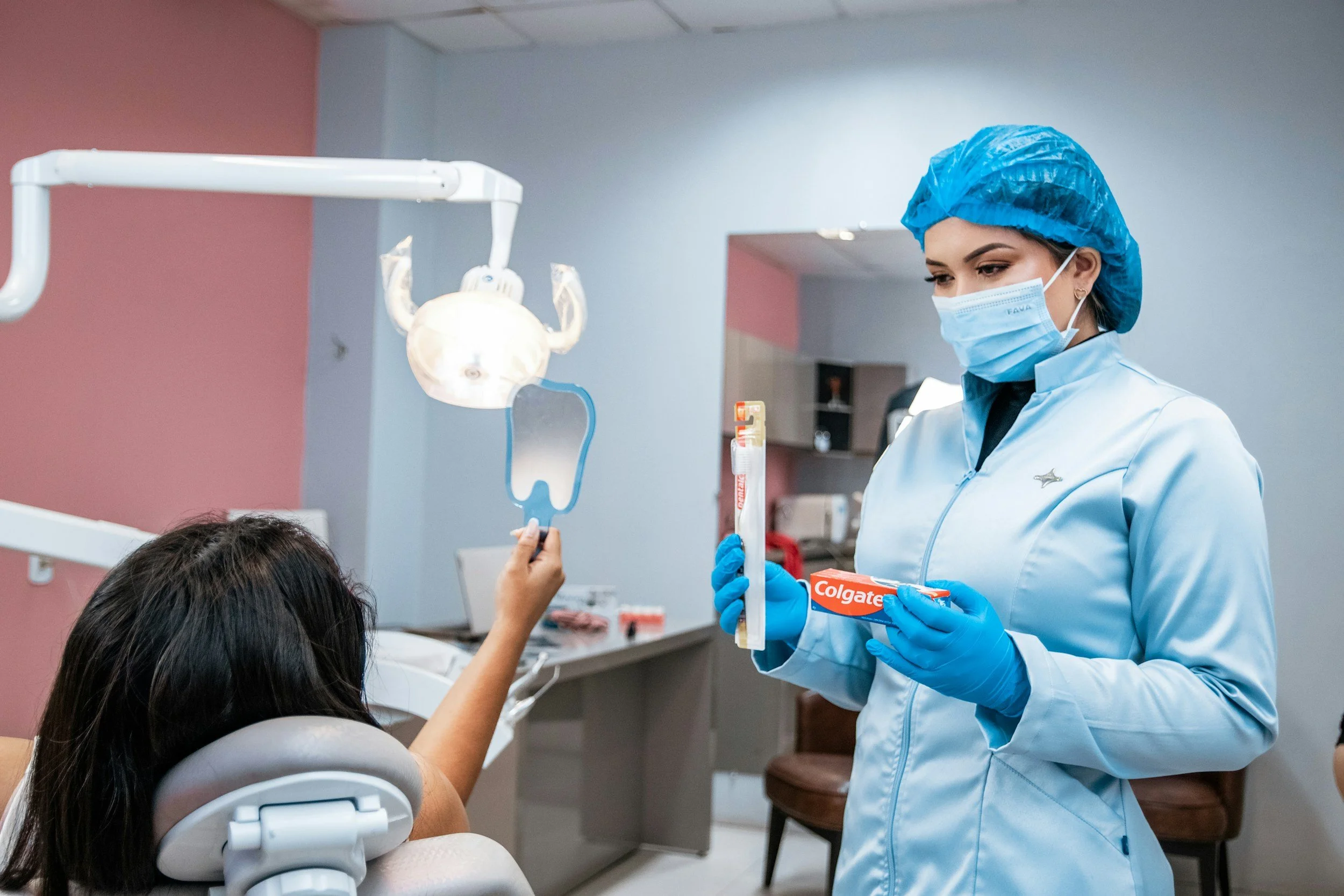Newport Beach Dental Associates — dentist with patient in modern clinic