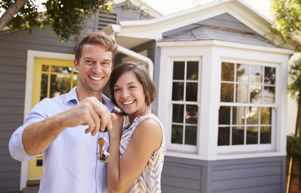 Happy couple receiving home keys