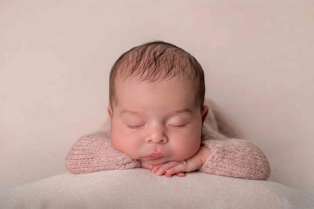 Newborn baby girl sleeping peacefully