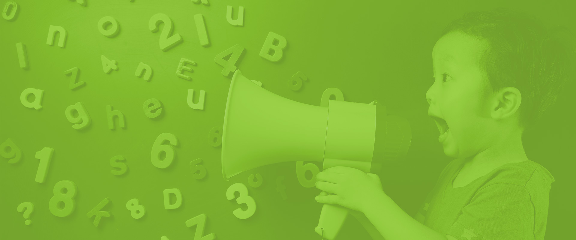 Child in speech therapy session, smiling and holding a megaphone