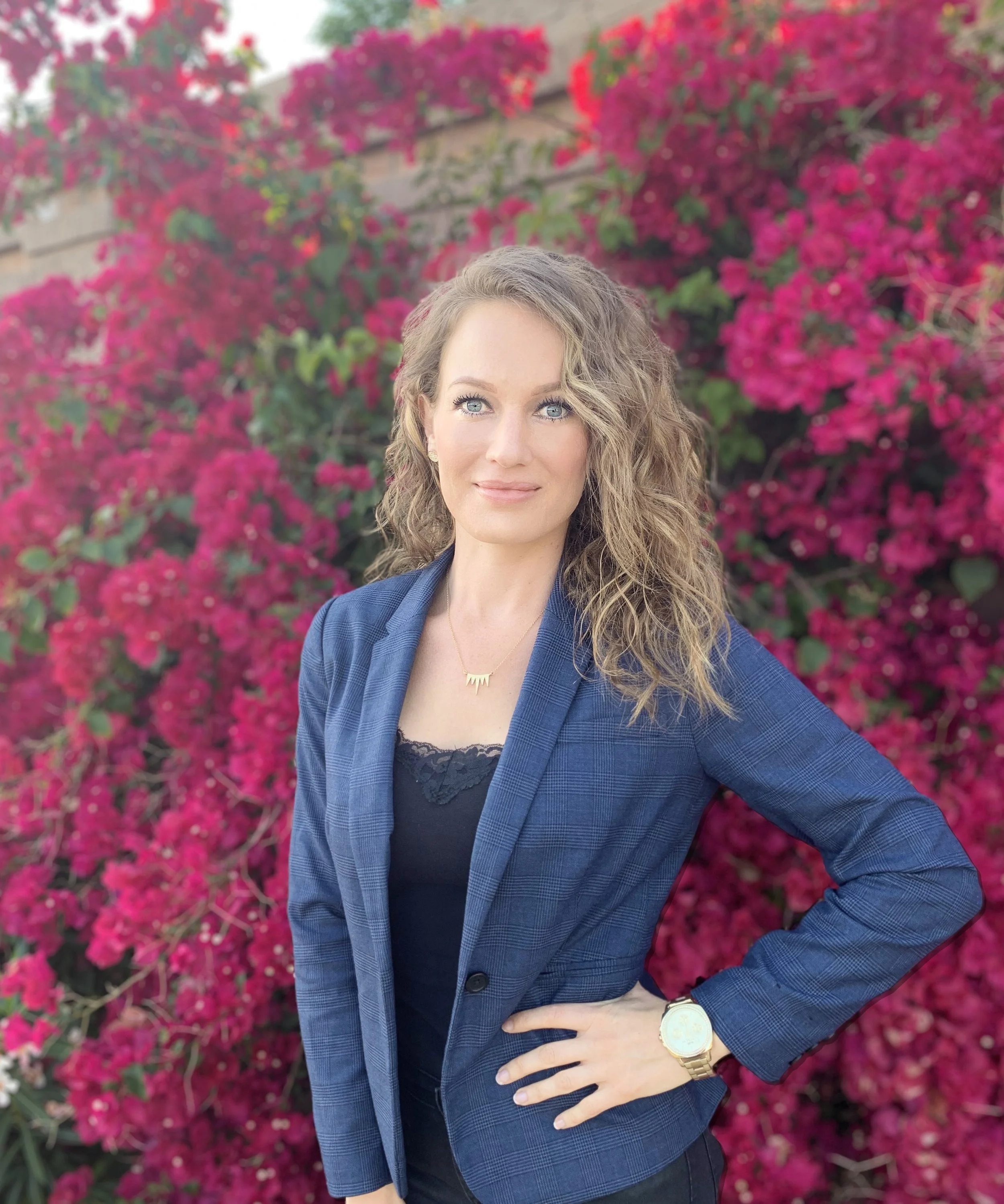 Therapist with curly blonde hair and blue eyes