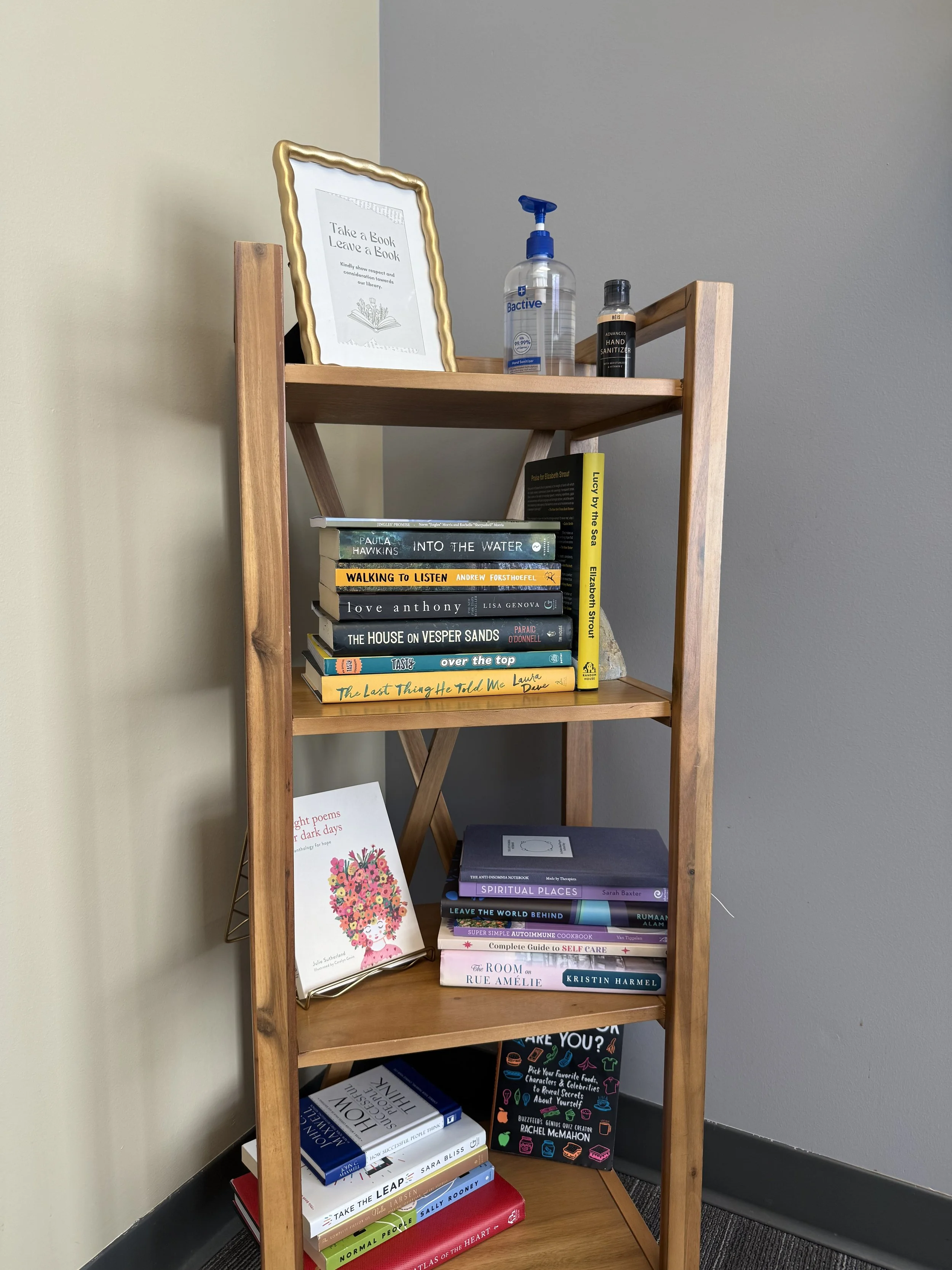 Bookshelf with Take a Book, Leave a Book sign
