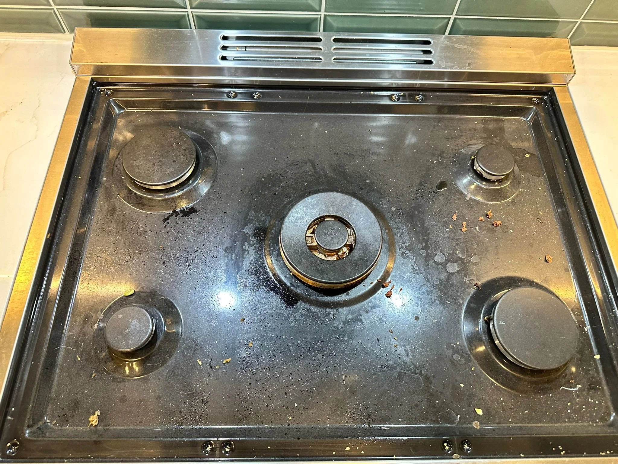 Dirty stove burners before cleaning