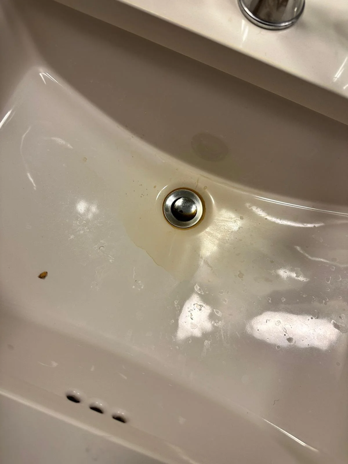 Dirty bathroom sink before cleaning
