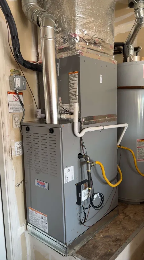 A man working on a computer in a factory