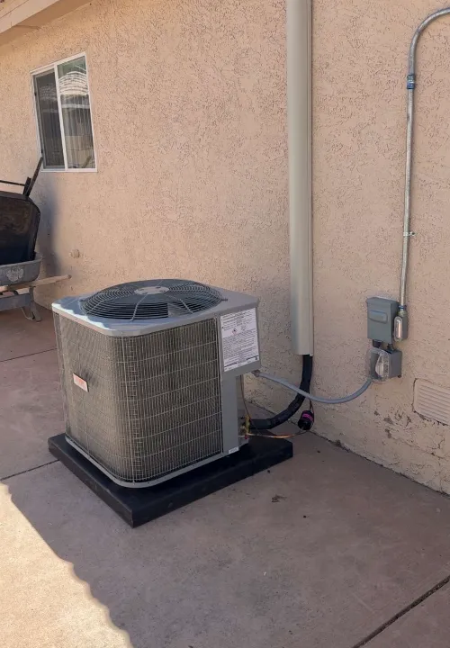 A man fixing a boiler with a screwdriver