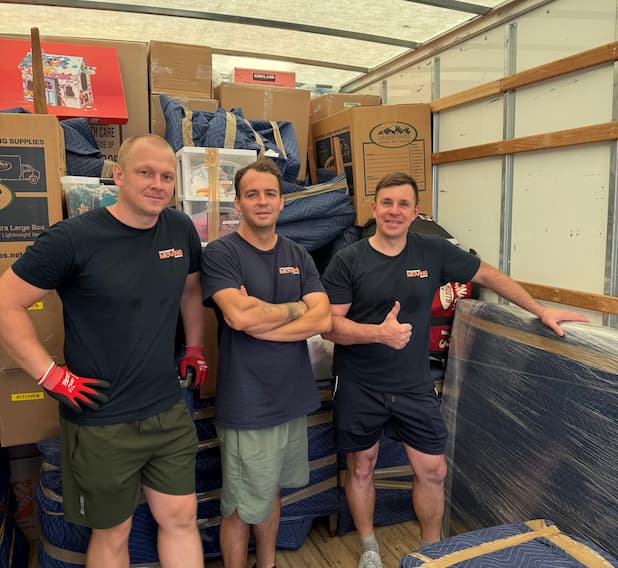 WellKnown Moving crew standing together on a job